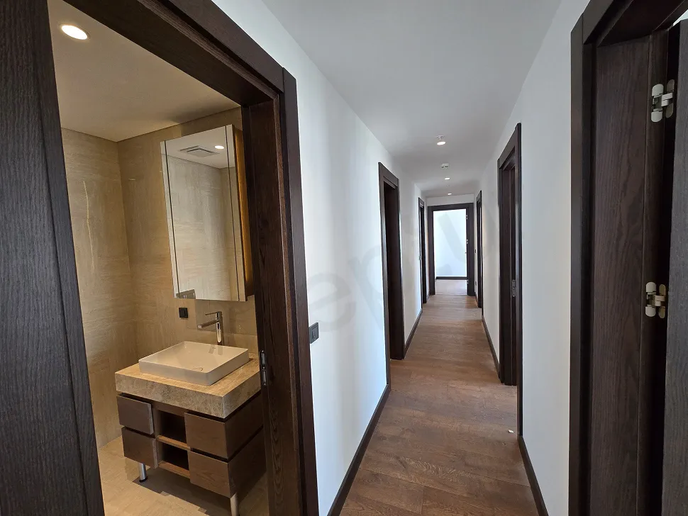 View of a spacious and bright corridor in a modern residence apartment.
