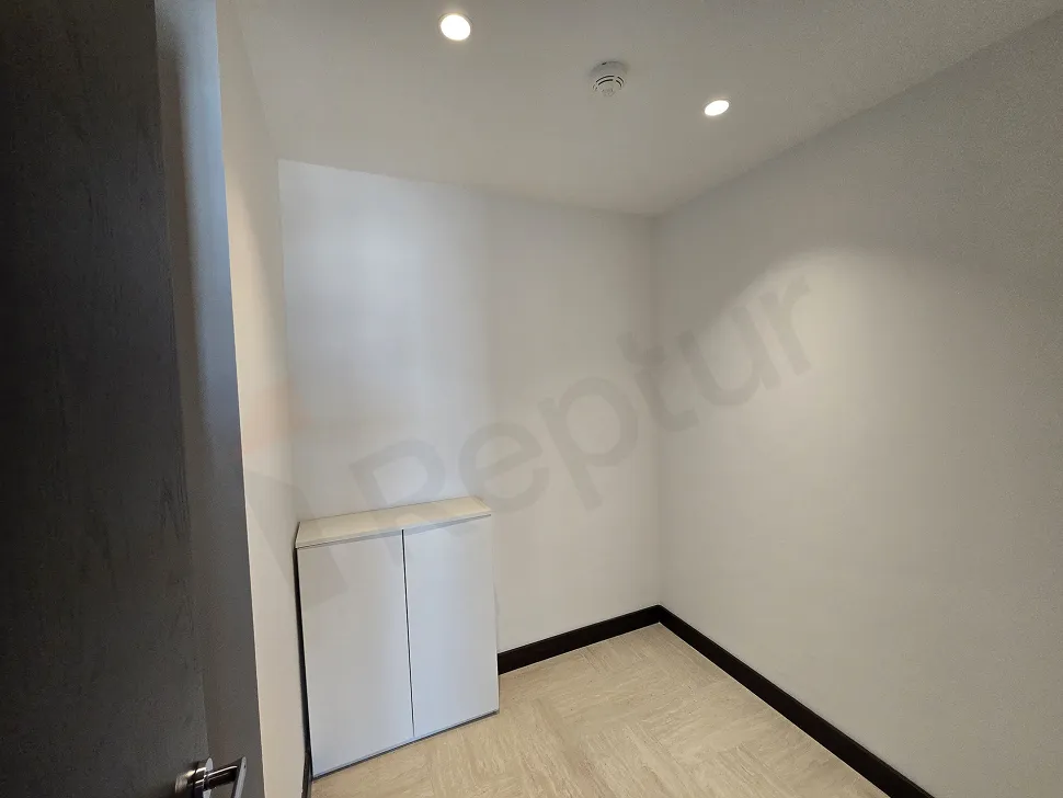 Spacious and secure storage area located within a modern residence project.