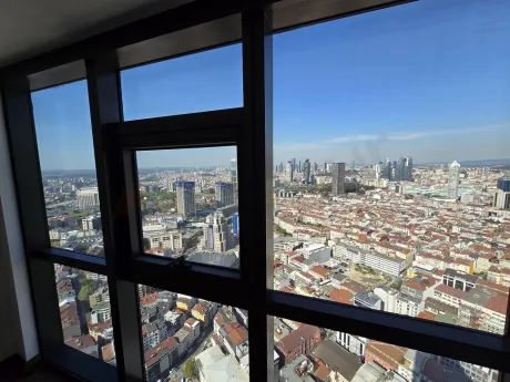 Panoramic city view of Istanbul Sisli from a high-rise luxury residence window.