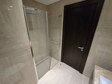 Stylish and modernly designed, spacious apartment bathroom.