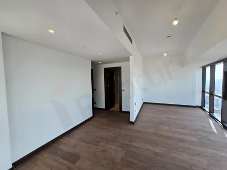 Spacious and bright empty bedroom of a luxury residence apartment in Sisli, Istanbul.
