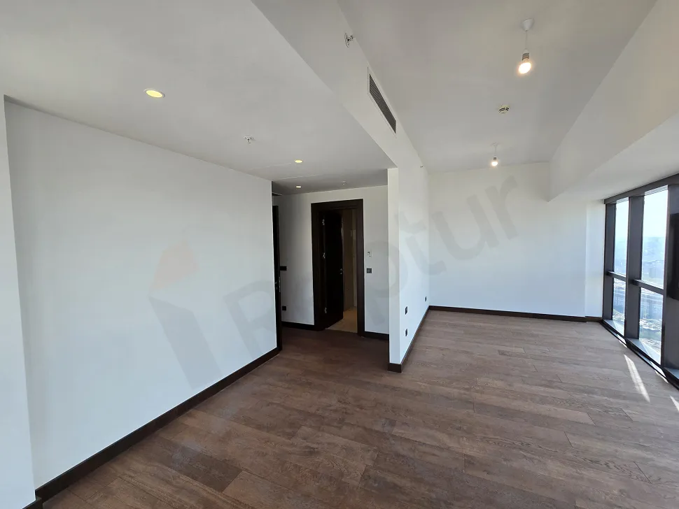 Spacious and bright empty bedroom of a luxury residence apartment in Sisli, Istanbul.