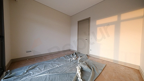 Image of a spacious and bright bedroom.