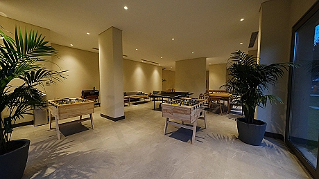 Modern gym with exercise equipment and large training area.