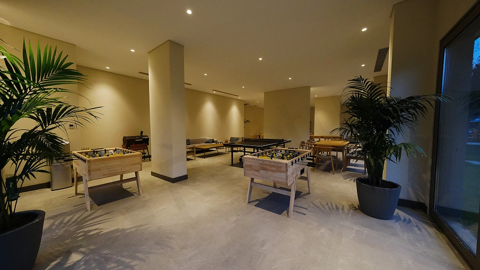 Modern gym with exercise equipment and large training area.