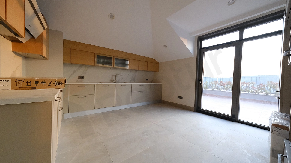 Modern designed unfurnished penthouse kitchen.