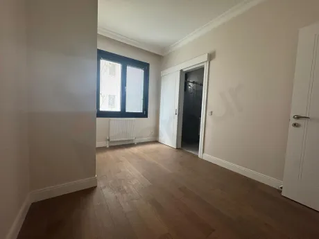 Interior view of a modern and spacious bedroom.