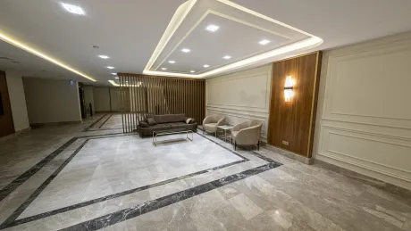 Modernly designed, spacious, and bright apartment lobby area.