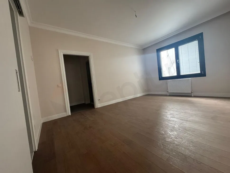 Spacious and bright bedroom with modern architecture in the apartment for sale in Kadikoy.