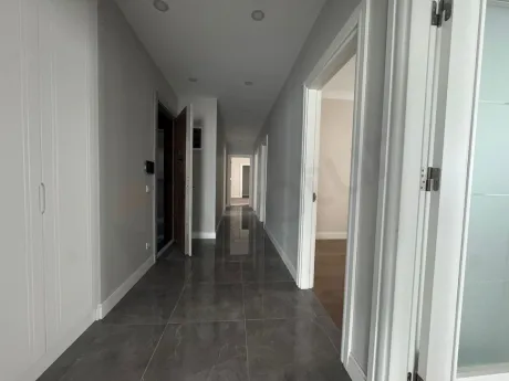 A spacious and bright apartment corridor with modern design.