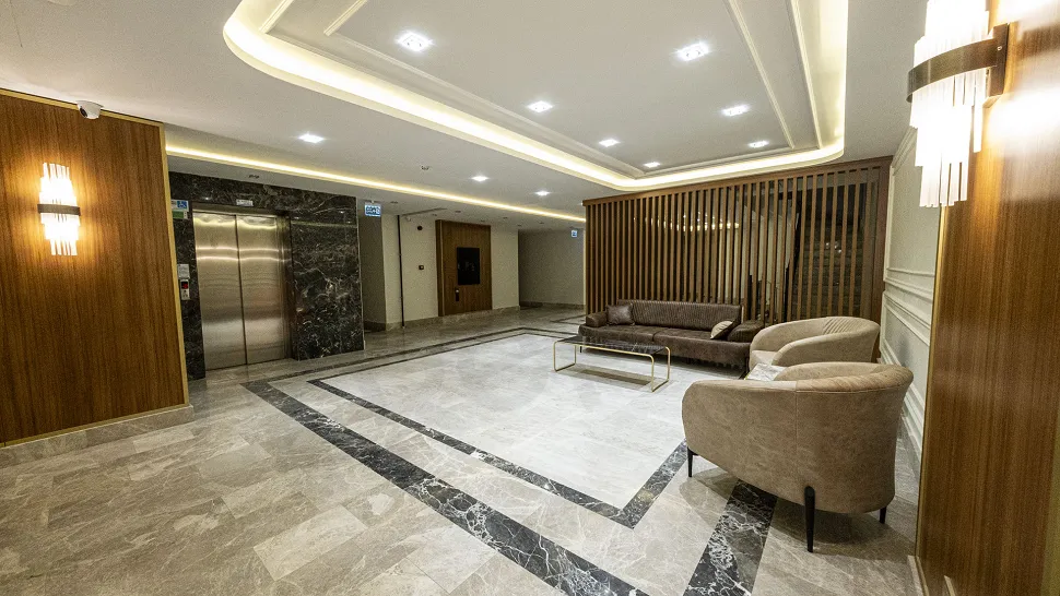 Spacious and elegantly designed lobby area of a modern luxury residence.