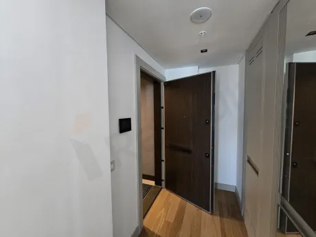 Modern and stylishly designed entrance door and hallway area of a luxury residence apartment in Şişli.