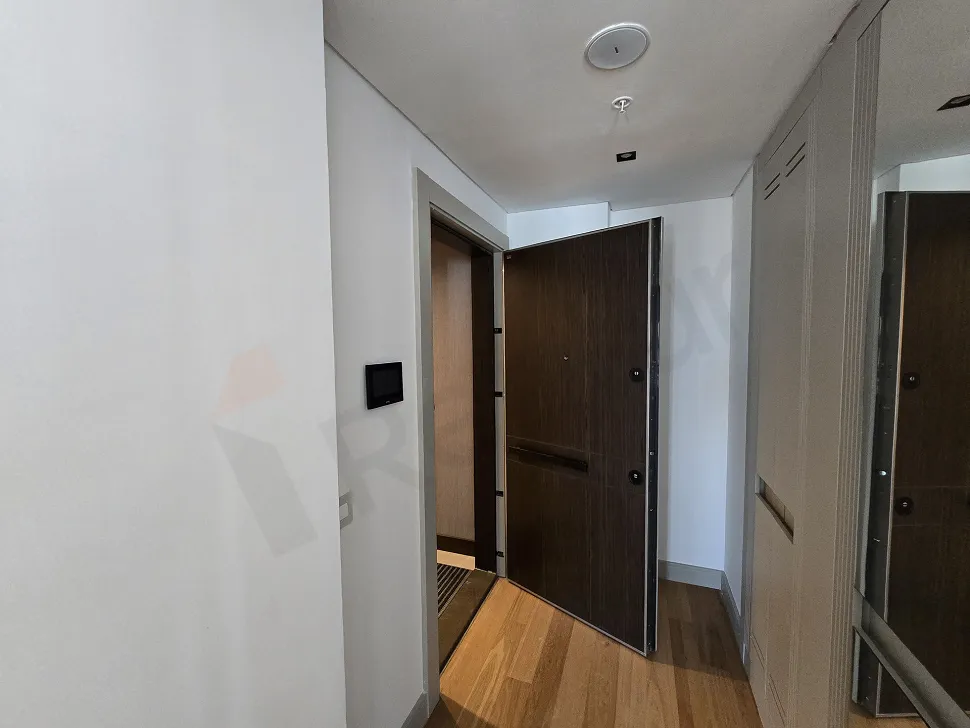 Modern and stylishly designed entrance door and hallway area of a luxury residence apartment in Şişli.