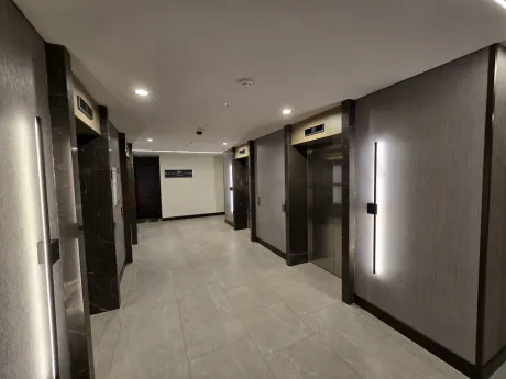 Modernly designed, bright and spacious apartment corridor.