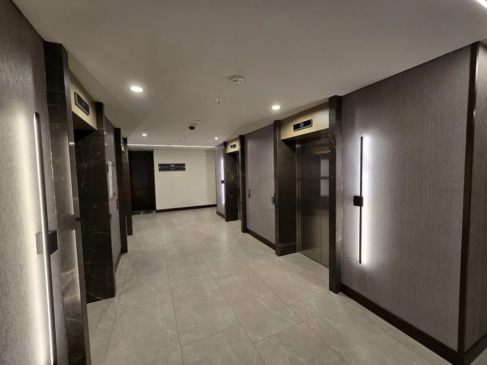 Modernly designed, bright and spacious apartment corridor.