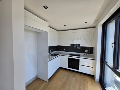 Modern and spacious residence kitchen with contemporary cabinets and countertops