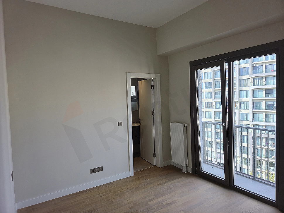 Modern bedroom design featuring a double bed, nightstands, lamps, and stylish wall decoration.