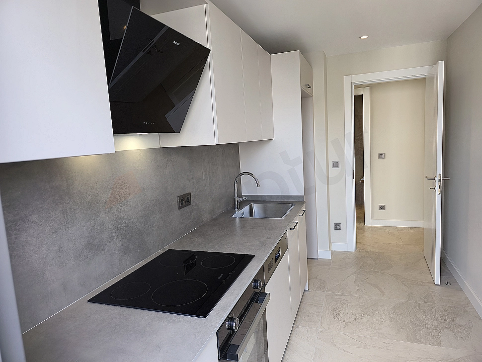 Modern white kitchen cabinets and countertop