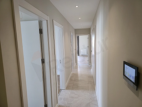 Bright and spacious apartment corridor with modern design.