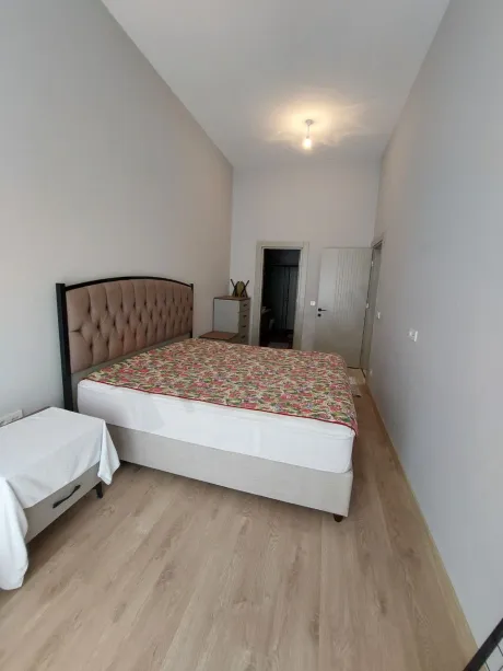 Interior view of a modern, spacious, and bright bedroom design.