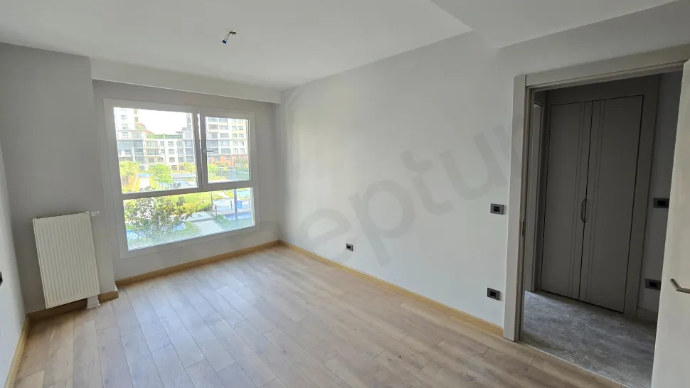 Modern and bright bedroom view with large windows in a luxury duplex apartment in Beylikdüzü.