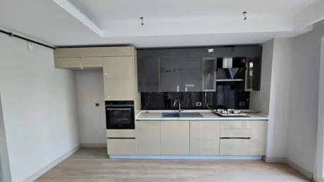 Spacious and bright kitchen area with modern design.