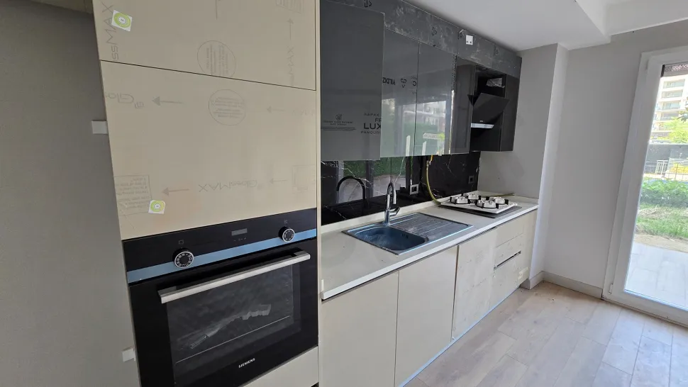 Modern and stylishly designed kitchen area with a spacious countertop.