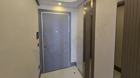 Entrance door and hallway area of a modern residence apartment.