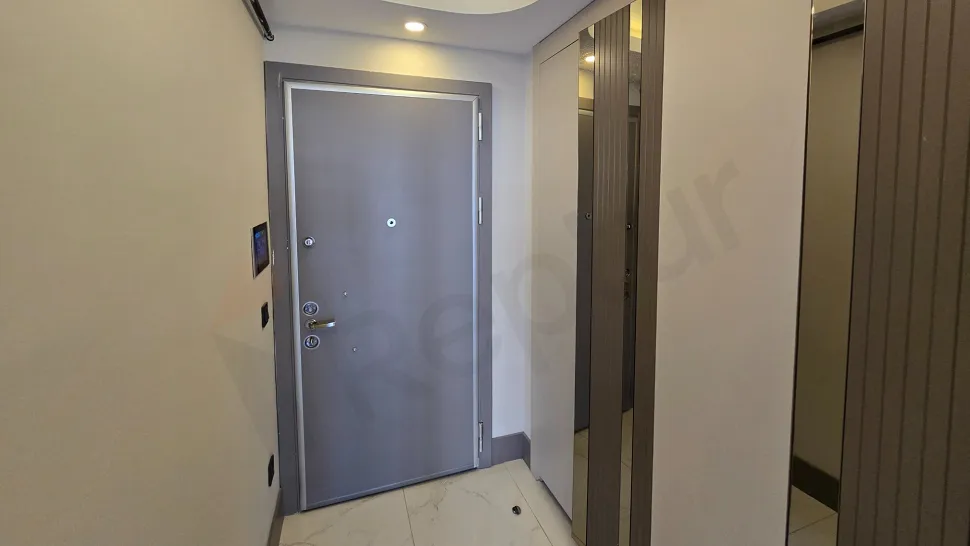 Entrance door and hallway area of a modern residence apartment.