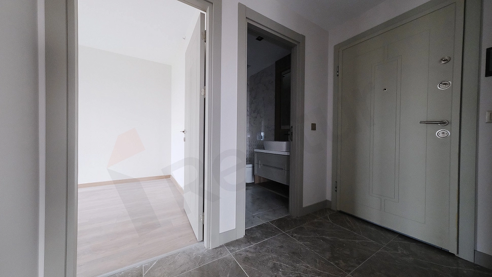 Apartment entrance door and hallway detail.