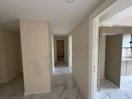 Bright and spacious corridor view of a modern apartment.