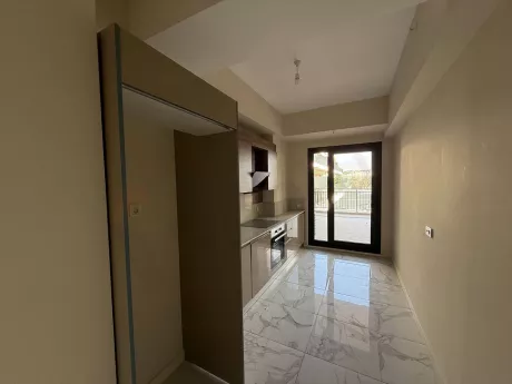 Modern designed, spacious and bright kitchen area.