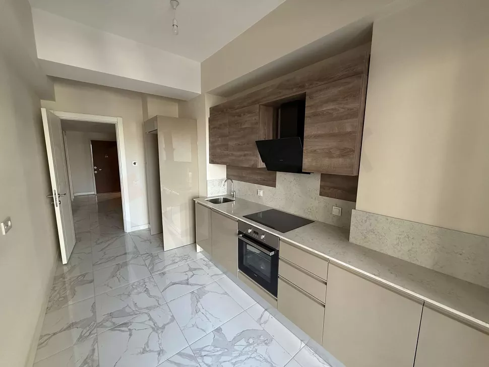 Spacious and modern kitchen design of a bright apartment.