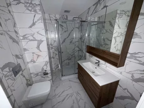 Modern bathroom interior featuring stylish tiles and high-quality sanitary ware.