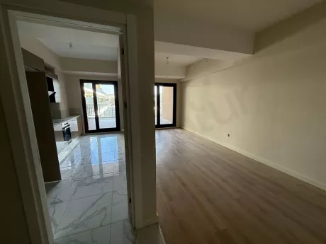 Spacious and bright living room area of a 2+1 apartment for sale in Çekmeköy, Istanbul.