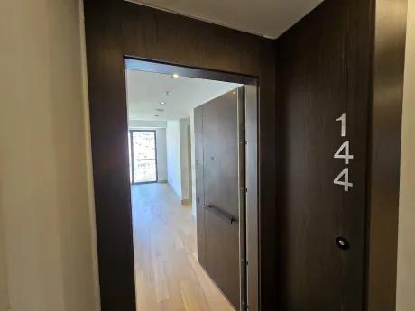 Spacious and bright apartment entrance hall in a modern building.