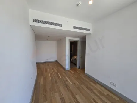 Spacious and bright bedroom area in a newly constructed luxury building.