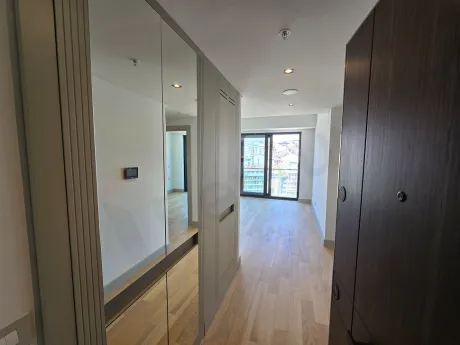 Modern interior staircase with wooden steps in a stylish apartment.