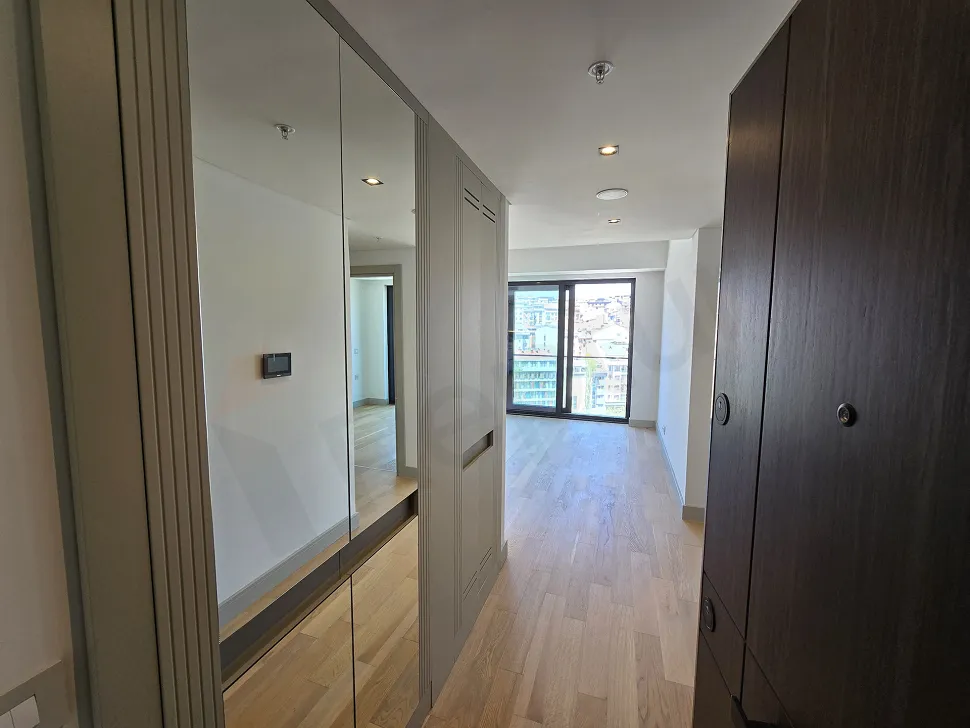 Modern interior staircase with wooden steps in a stylish apartment.
