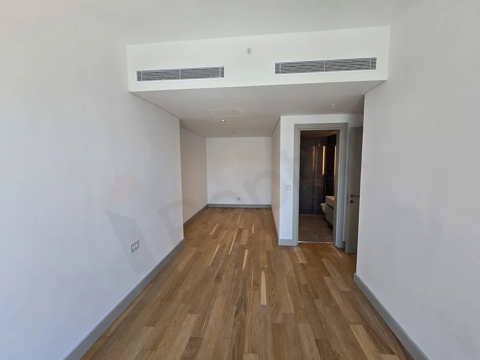 Interior view of a modern, spacious and bright bedroom with a contemporary design.