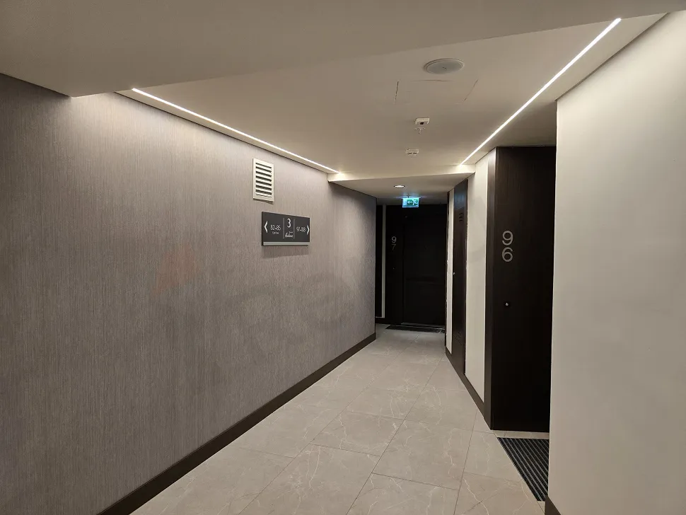 Spacious and elegantly designed lobby area of a modern luxury residence