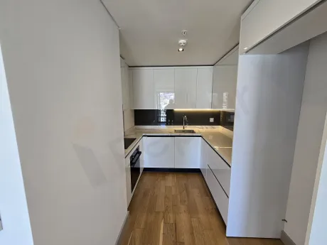 Spacious and bright open kitchen area in a modern apartment.