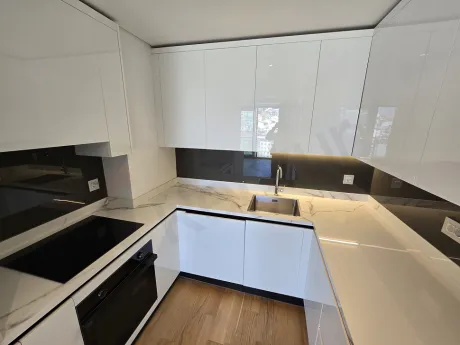 Stylish and spacious open kitchen design in the interior of a modern apartment.