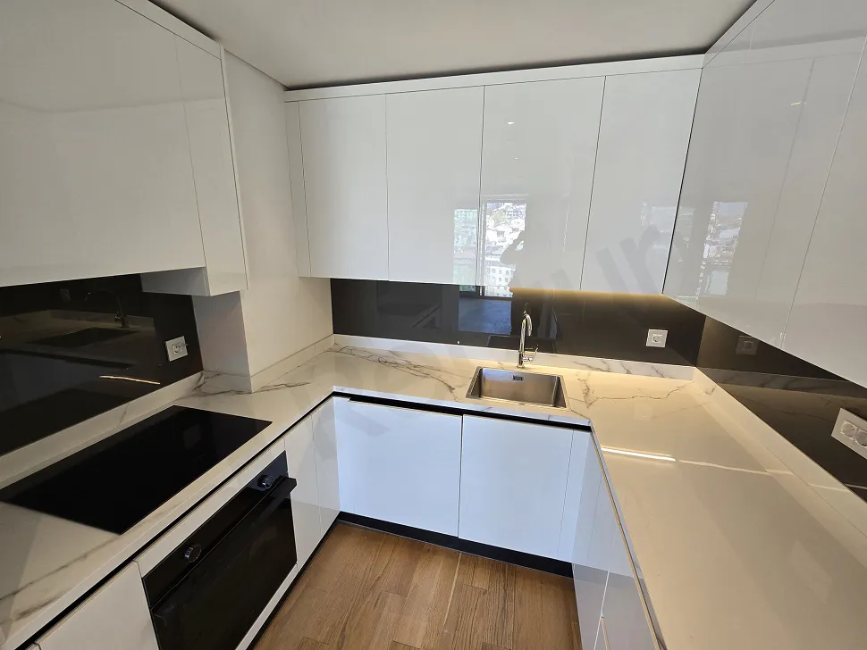 Stylish and spacious open kitchen design in the interior of a modern apartment.