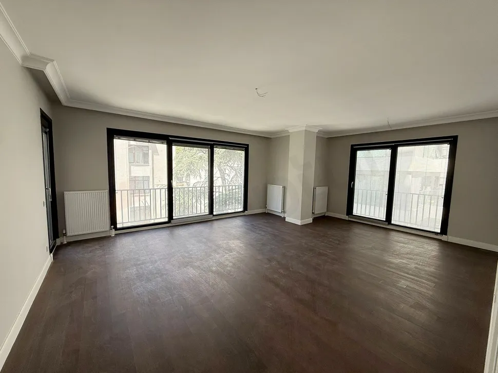 Interior view of a spacious and bright modern living room.