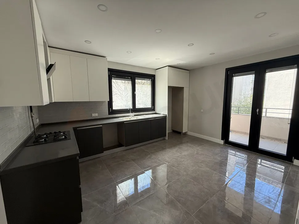 A spacious and bright kitchen area with a modern design