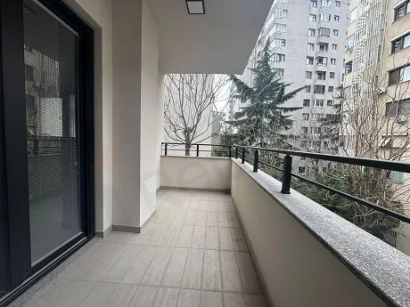 Modern balcony with city view and glass railings in Kadıköy, Istanbul.