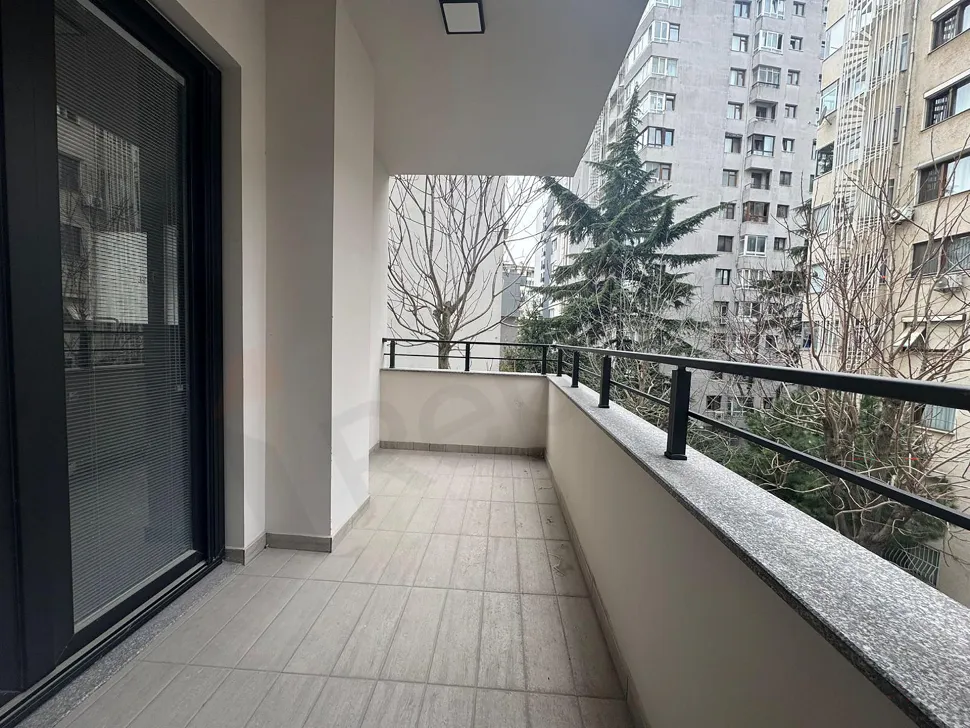 Modern balcony with city view and glass railings in Kadıköy, Istanbul.