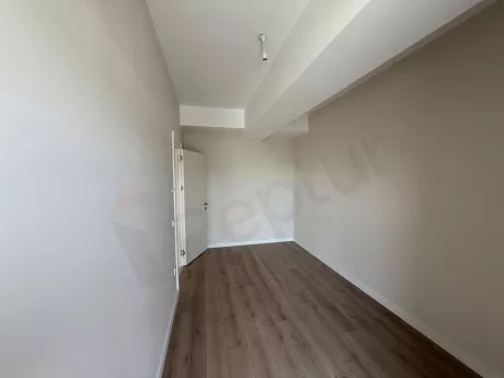 A spacious and bright modern bedroom interior view.