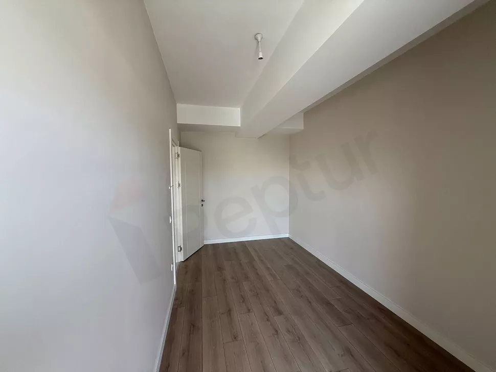 A spacious and bright modern bedroom interior view.